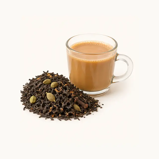 Loose Assam tea with cardamom and a glass cup of masala chai