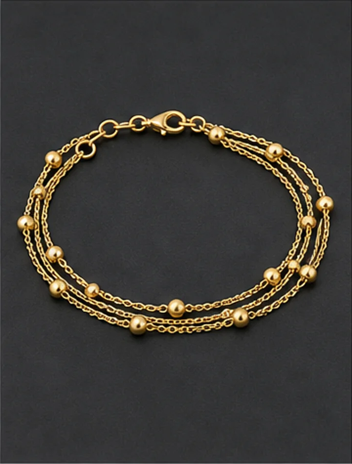 Layered fine gold chain bracelet with tiny beads