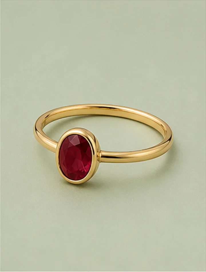 Slim gold ring set with an oval ruby