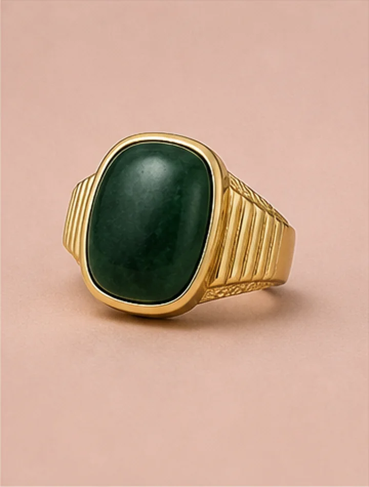 Statement gold ring with a dark green stone